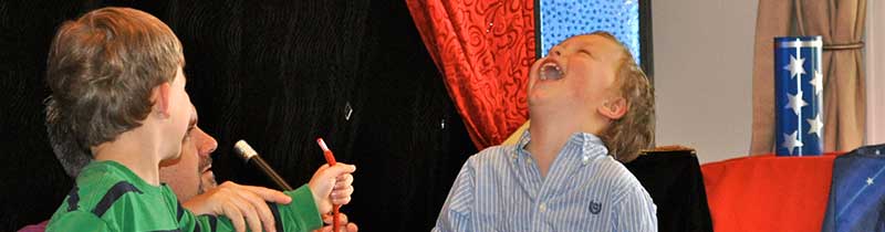 Laughing child at Denver kids magician Chad Wonder's magic show